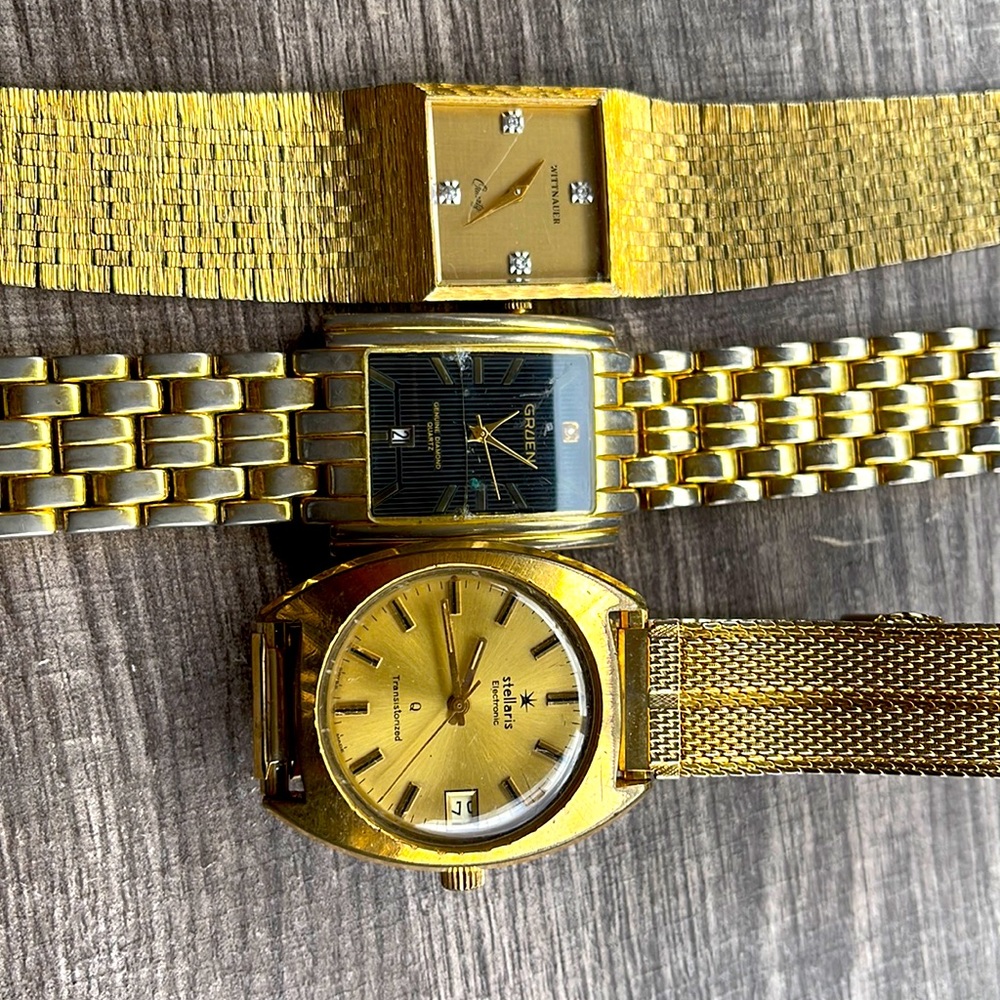 Three men’s watches.  A Whitnaer, a Gruen and a Stellarus.